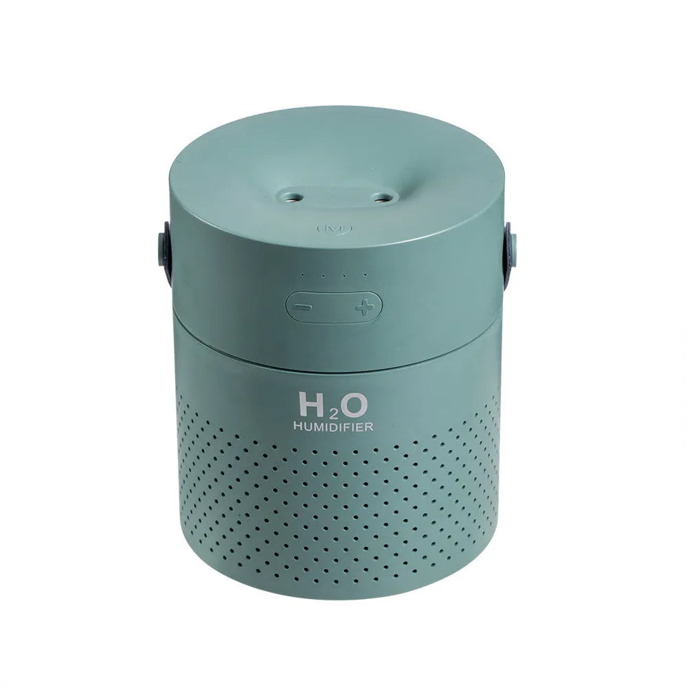 Green wireless bedroom humidifier with colour-changing light and USB port on a bedside table