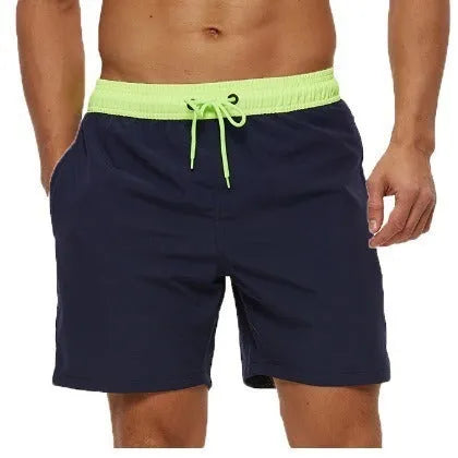 Men's blue drawstring athletic shorts with a zipper pocket and stitching detail on the waistband