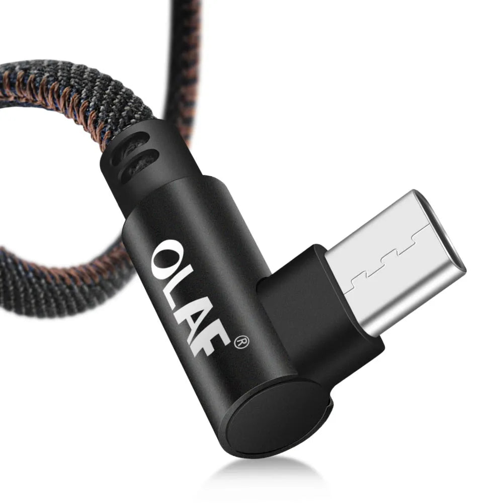 Fast charging USB cable with denim textile exterior and aluminium connectors in black, blue, and red.