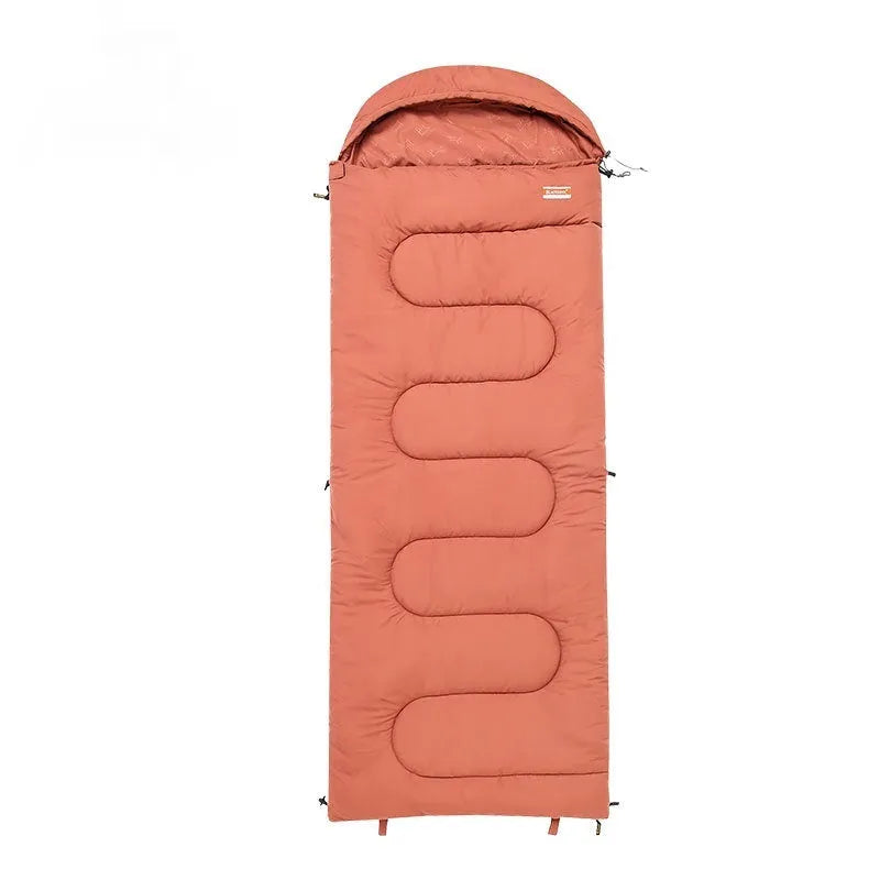 Outdoor cotton sleeping bag in ochre or olive green colour folded for portability