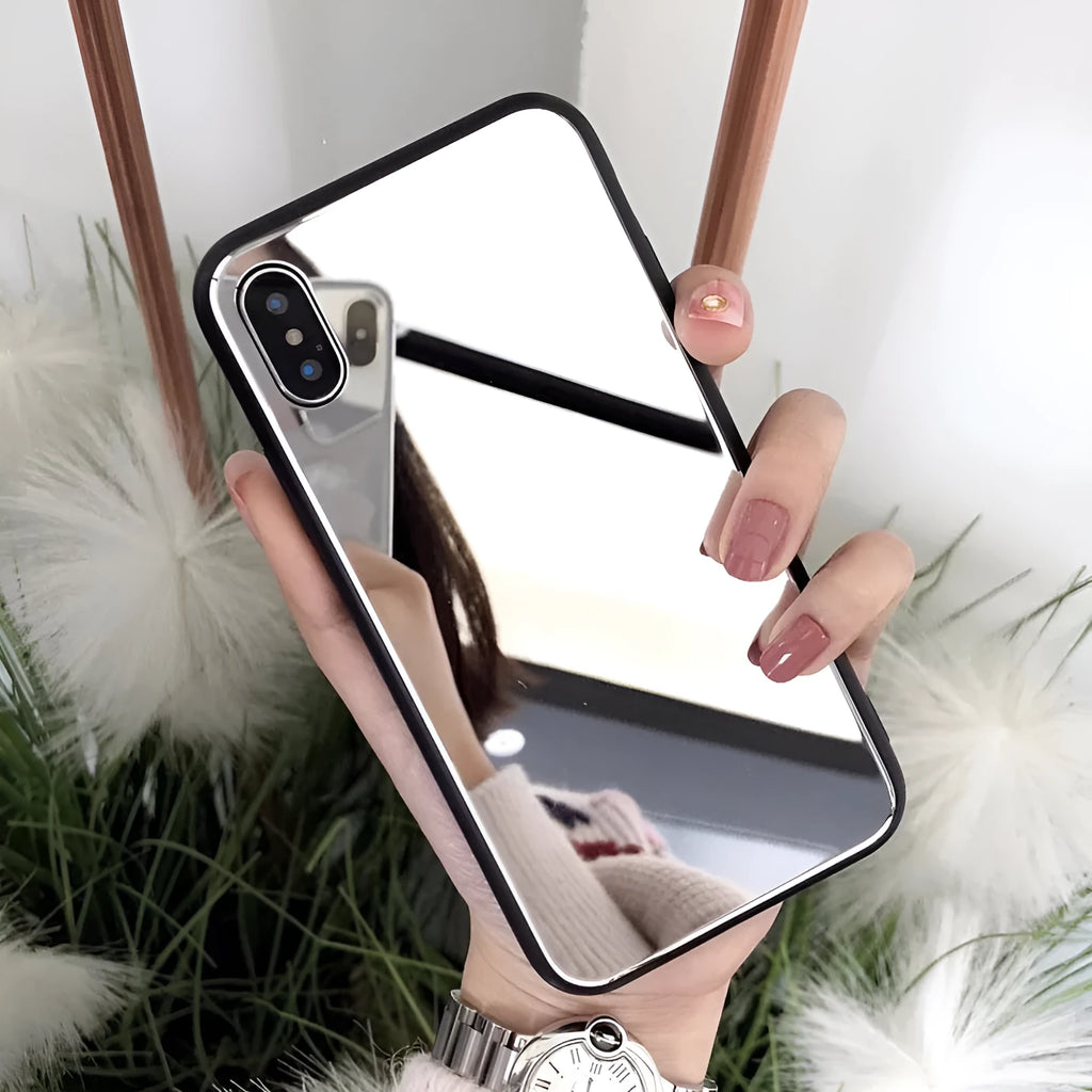 Black mirrored back cover phone case for Apple iPhone models on a table.