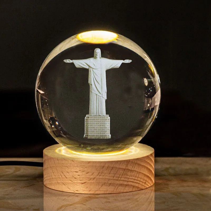 White crystal ball with cross and religious symbols on wooden LED base desk ornament