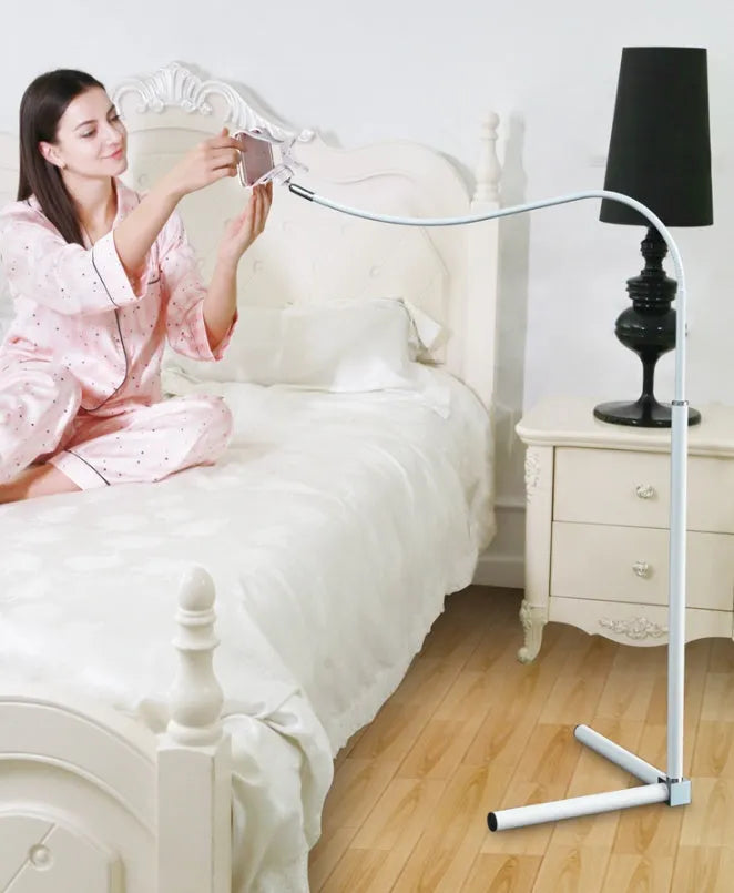 Black bedside mobile phone bracket with adjustable overhead shelf mounted beside bed frame
