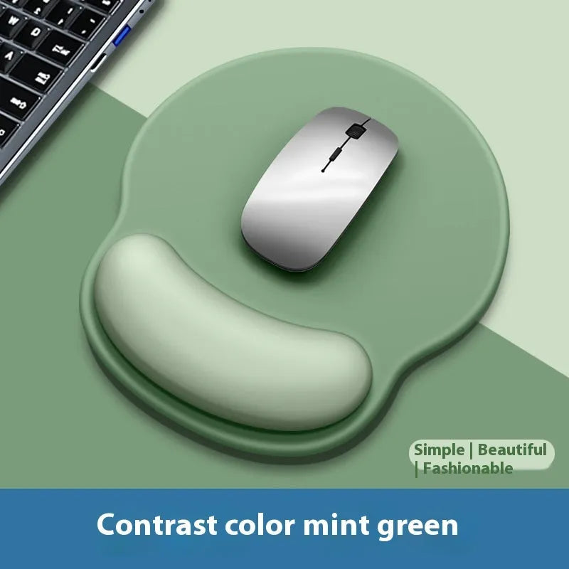 Silicone mouse mat with wrist rest in gradient colour pattern on desk