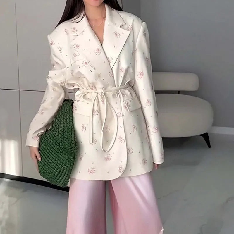 Women's white suit jacket with lace-up waist detail and regular long sleeves