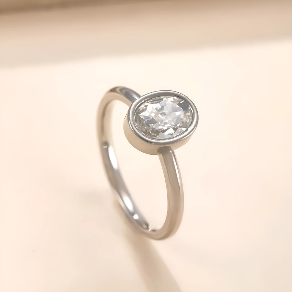 Stainless steel ring with oval zircon stone in geometric shape, unisex, available in steel and gold colours