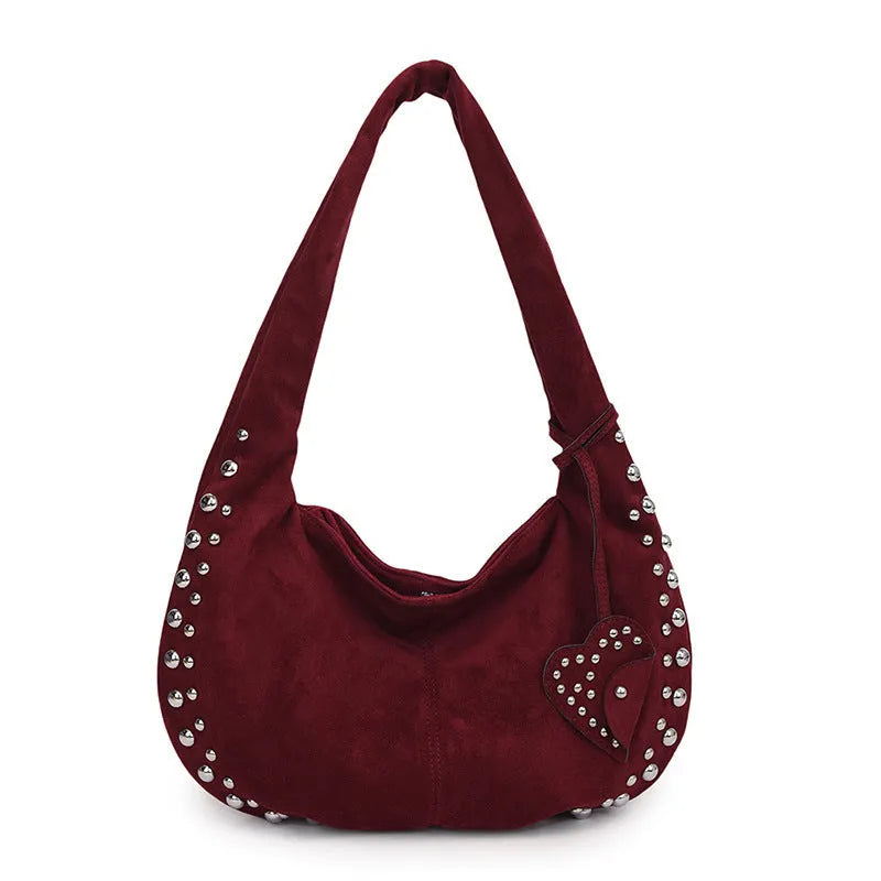 Soft plush retro tote handbag for women in a choice of colours, shown with strapless underarm carry.