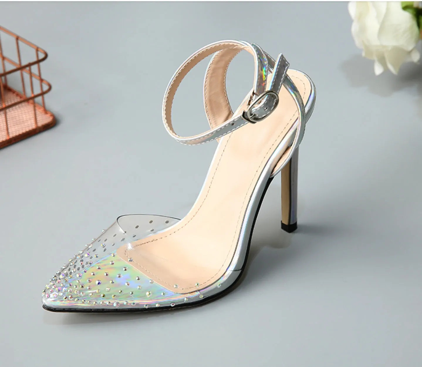 Women's pointed toe diamond sandals with stiletto heels on a white background.