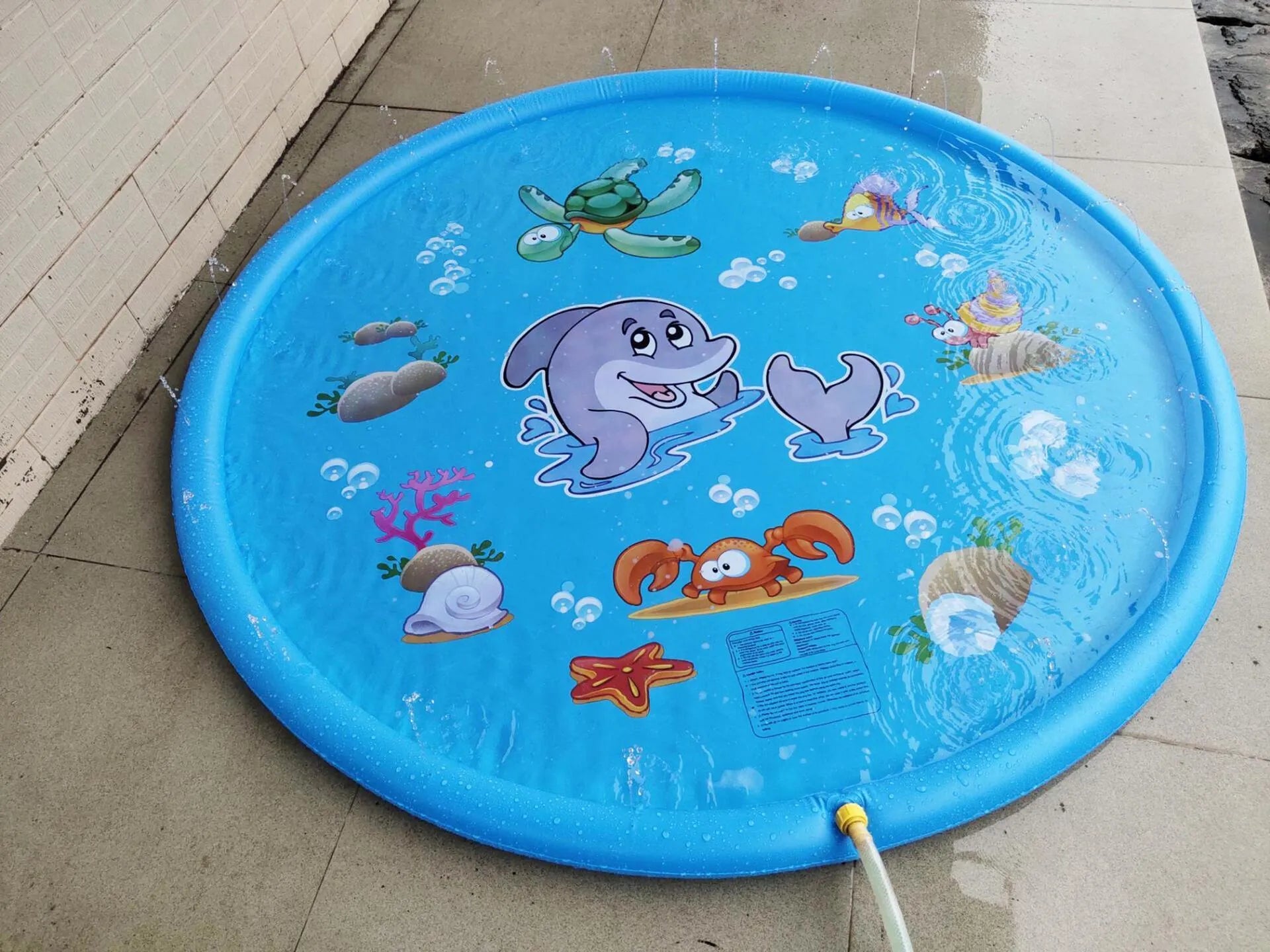 Blue PVC children's water spray mat with marine animal prints, measuring 100cm by 170cm