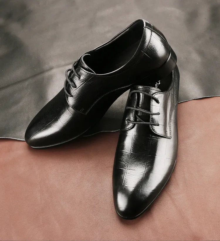 Men's black cow leather Derby shoes with pointed toe and rubber sole on a plain background