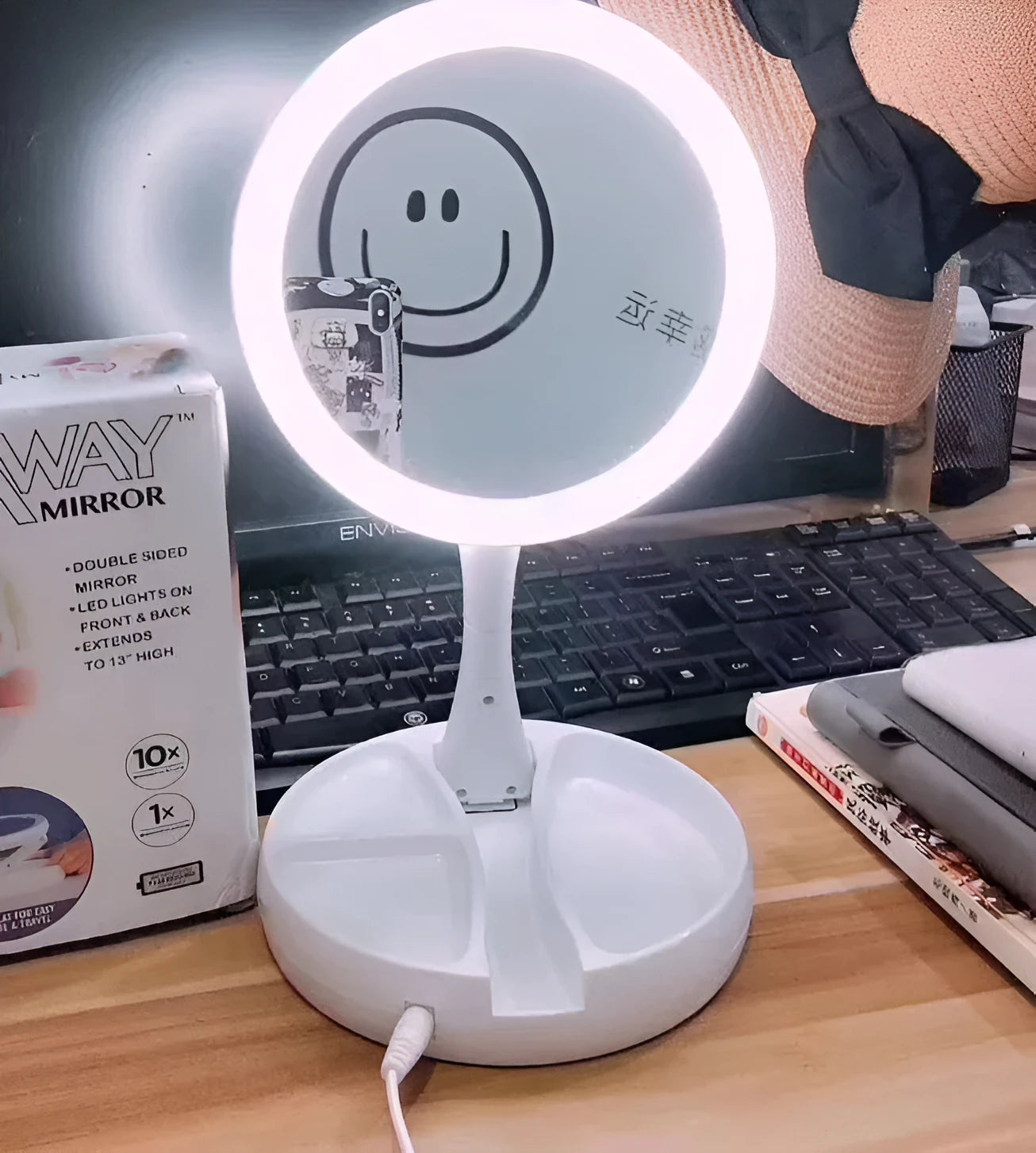 White foldable LED vanity mirror with open storage compartments and USB charging port.