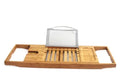 Natural bamboo bathtub caddy tray with one shelf resting on a bath edge.