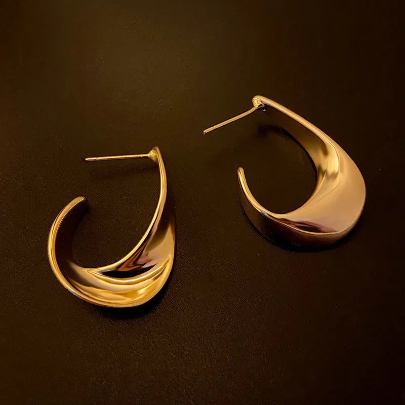 Twisted geometric metal earrings with electroplated gold or silver finish