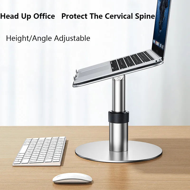Silver aluminium car laptop stand shown at an adjusted height with a laptop secured on top.