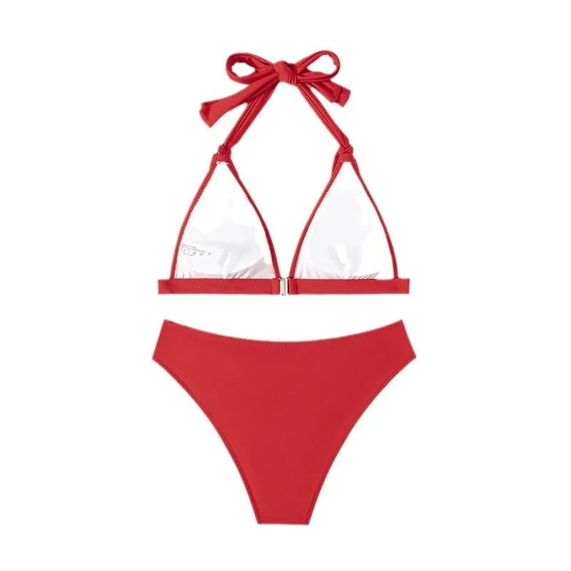 Red women's lace-up halterneck bikini set with high-cut shorts on a mannequin