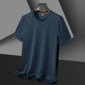 Man wearing a black loose-fit jacquard short sleeve t-shirt made from cool Ice Silk fabric.
