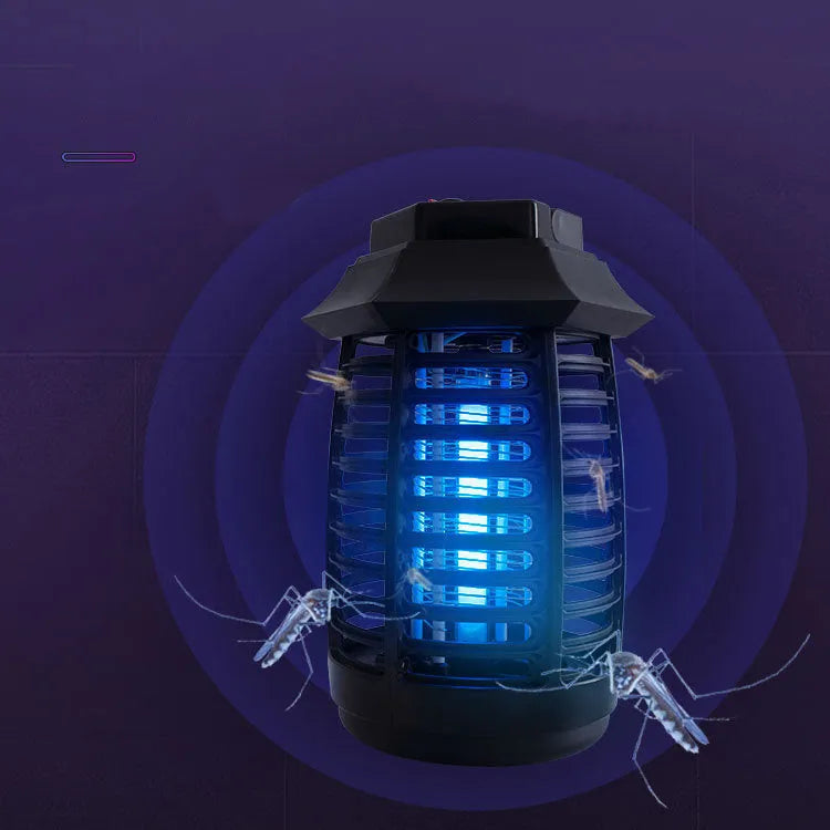 Black aromatherapy mosquito lamp insect killer trap on a surface.
