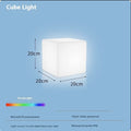 White square LED cube stool light for outdoor use, showing modern design with solar panel or charging port.