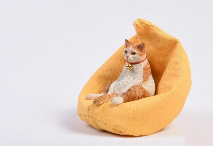 Lazy cat car ornament figure with sofa accessory on dashboard