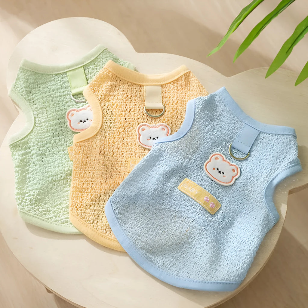 Green cat jumper with bear patch design showing breathable knitted fabric