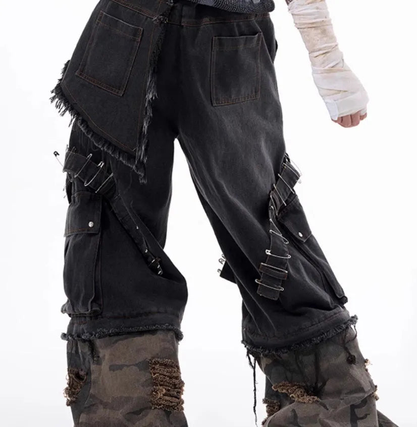 Men's grey camouflage jeans with splicing panel design and decorative pin and ribbon details