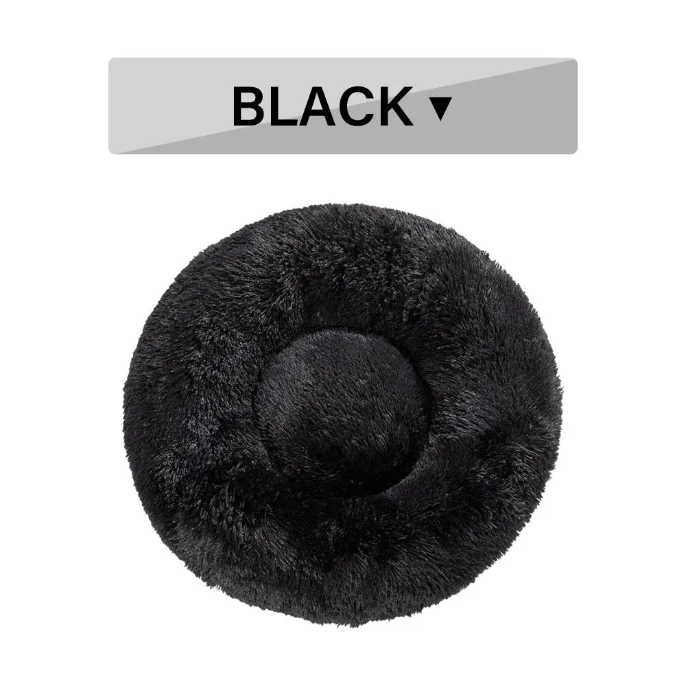 Fluffy donut-shaped pet bed in long plush fabric, shown in a light grey colour.