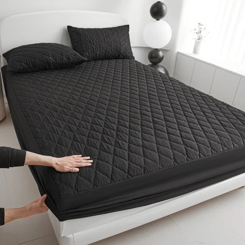 Diamond lattice quilted bamboo fibre mattress protector fitted sheet and pillowcases in solid colour.
