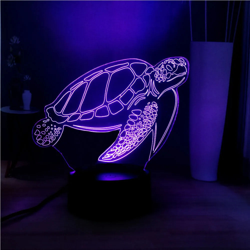 3D acrylic turtle-shaped LED night light showing colour-changing glow and remote control.