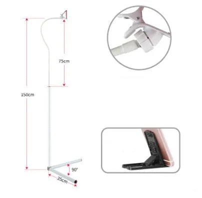 Black bedside mobile phone bracket with adjustable overhead shelf mounted beside bed frame