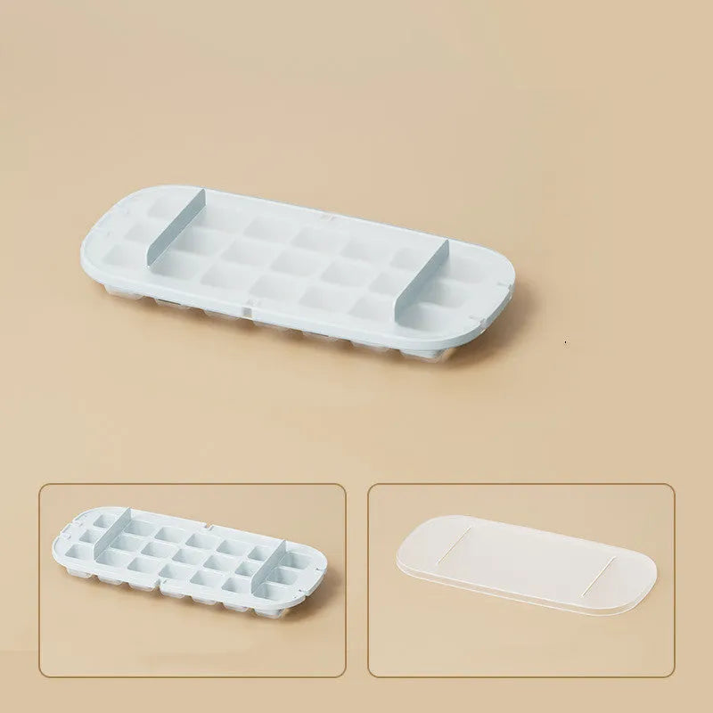 High-capacity ice cube tray in blue with leverage handle and integrated ice shovel storage compartment