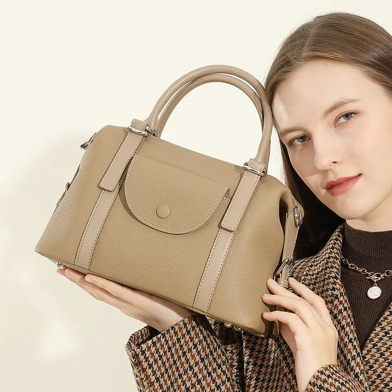 Genuine leather ladies handbag with combination lock and single strap in street trend style