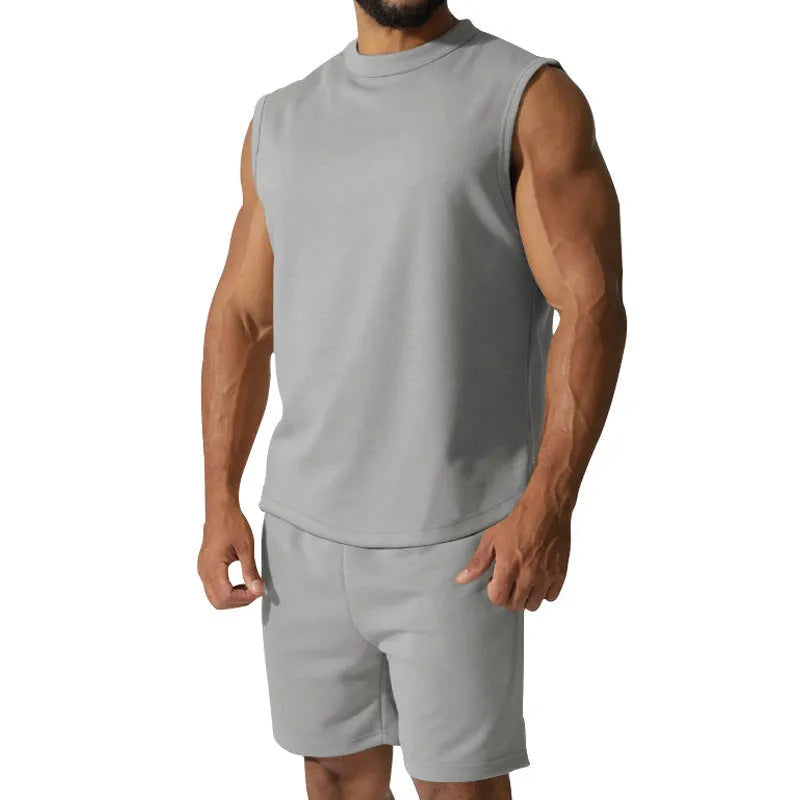 Men's sleeveless cotton blend sports top and matching shorts in solid colour options