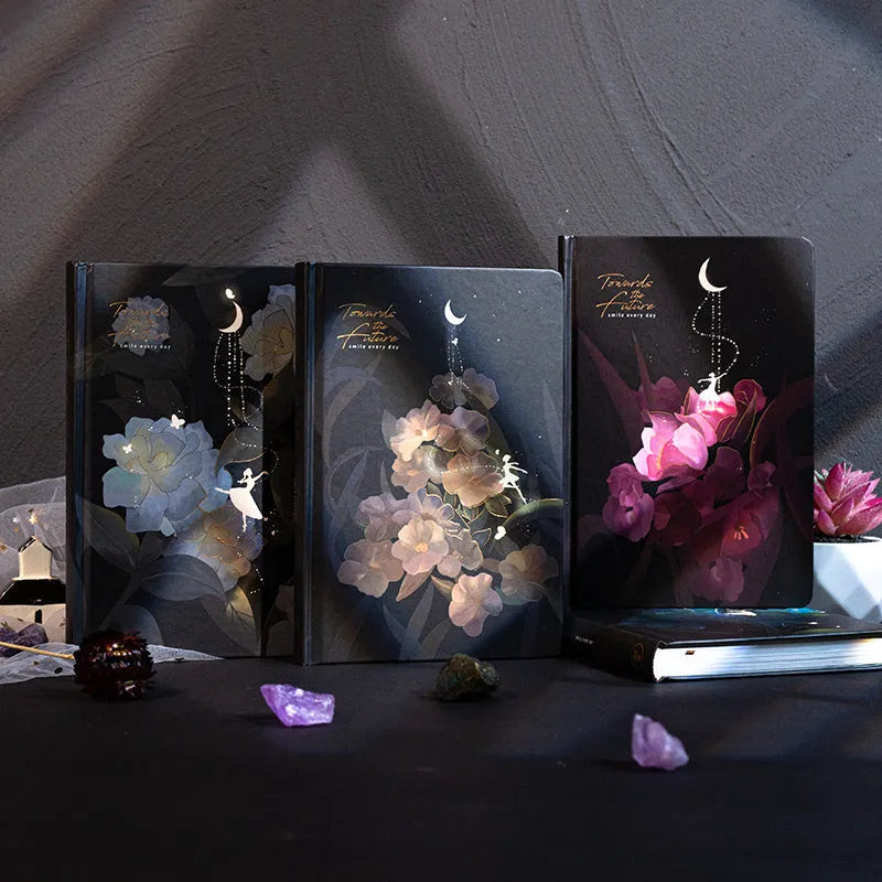 A5 notebook with a luminous cover open to show internal colour illustrations, next to Purple, Light Blue, Gold, and Deep Blue colour options.