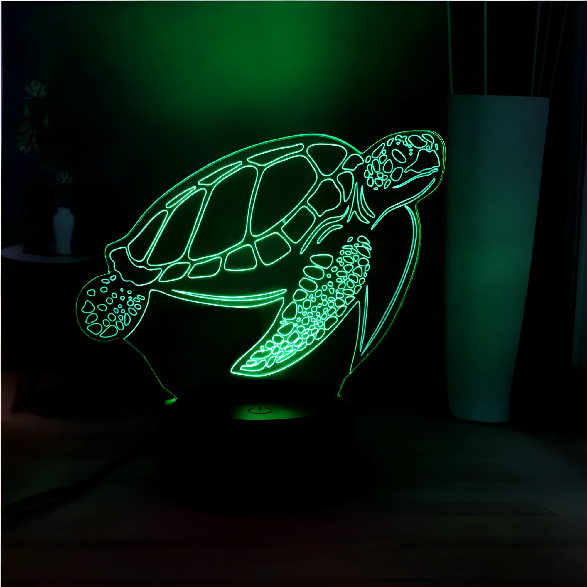3D acrylic turtle-shaped LED night light showing colour-changing glow and remote control.
