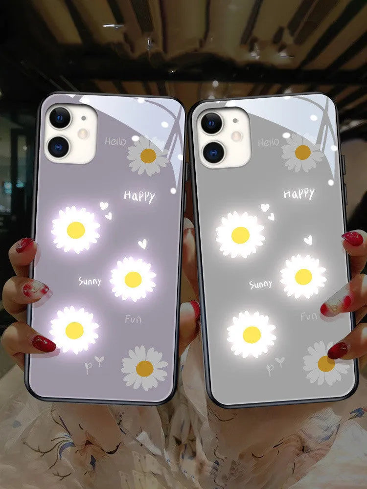 White luminous phone case with painted daisy design for Apple iPhone, showing voice-activated light feature.