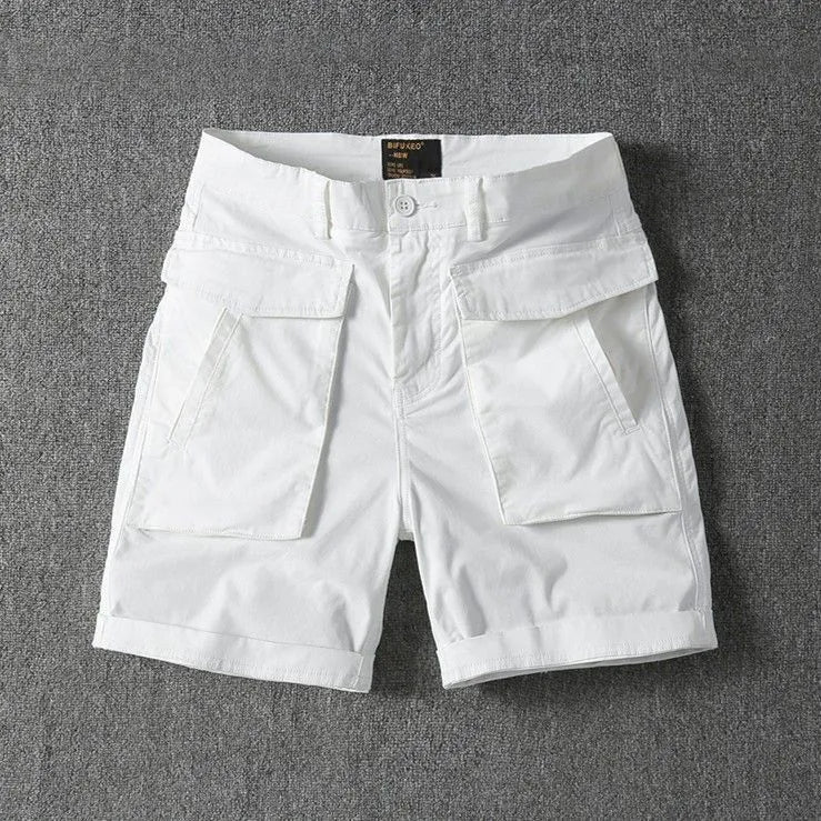 Men's army green cotton cargo shorts with multiple pockets, shown in a straight-leg summer street style.