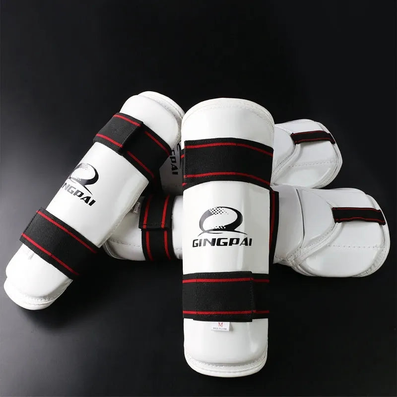 Taekwondo protective gear set showing leg guards, arm guards and elbow protection in PU EVA construction