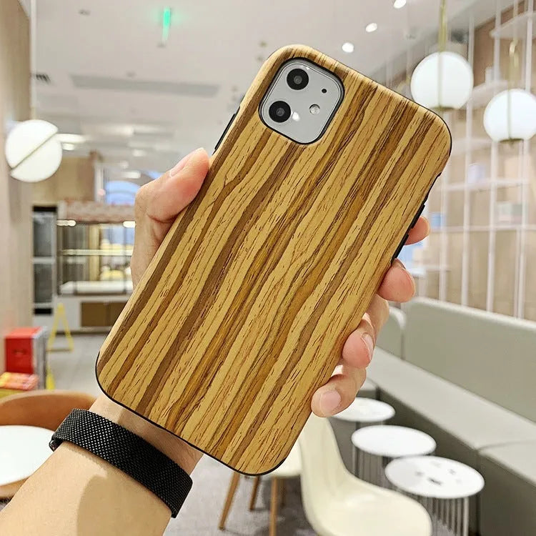 Wooden iPhone back cover case in rosewood finish showing precise cutouts for camera and ports.