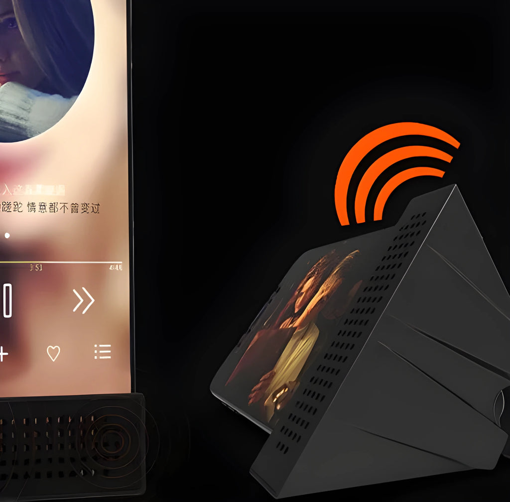 Mini portable phone amplifier bracket for Apple iPhone on a desktop in pink colour.