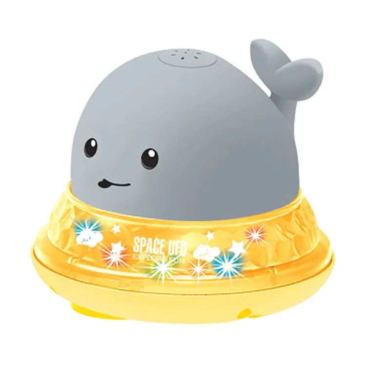 Automatic water spray whale bath toy with colourful LED lights floating in baby bath