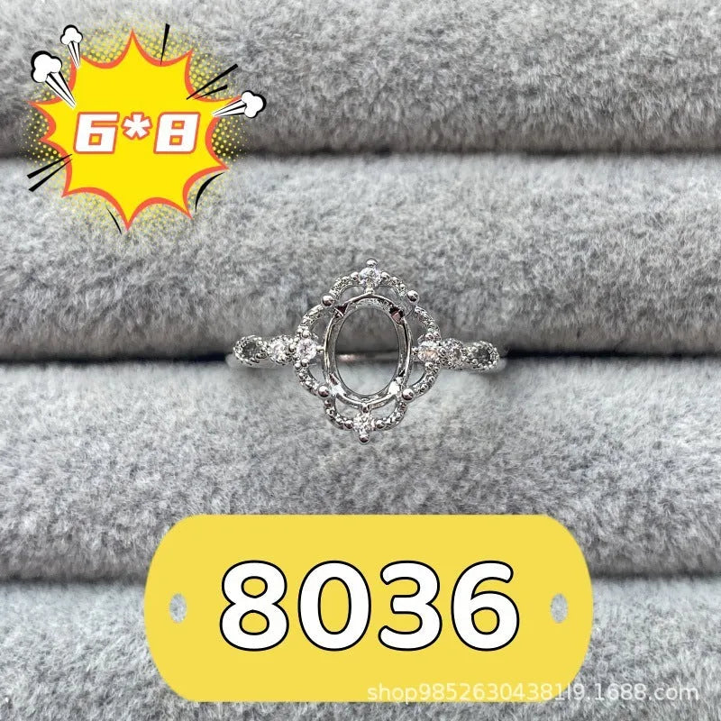 Oval denier ring with five-pointed star ornamentation and 6x8 mm main stone