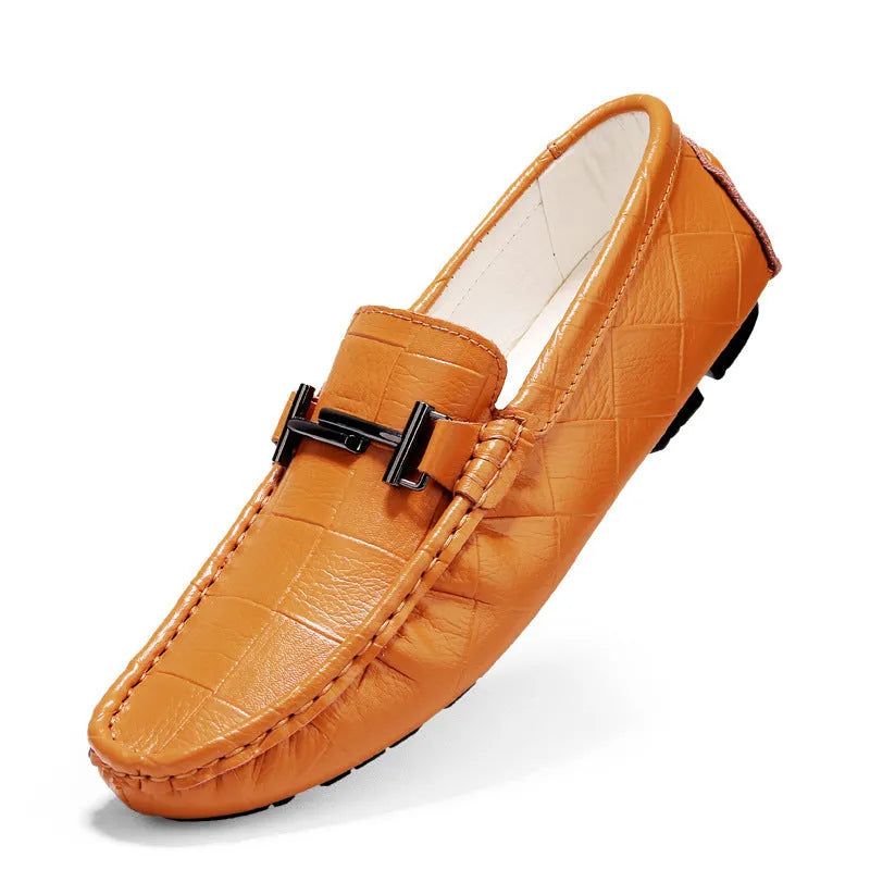 Men's black leather casual shoes with a silver belt buckle and flat rubber sole.