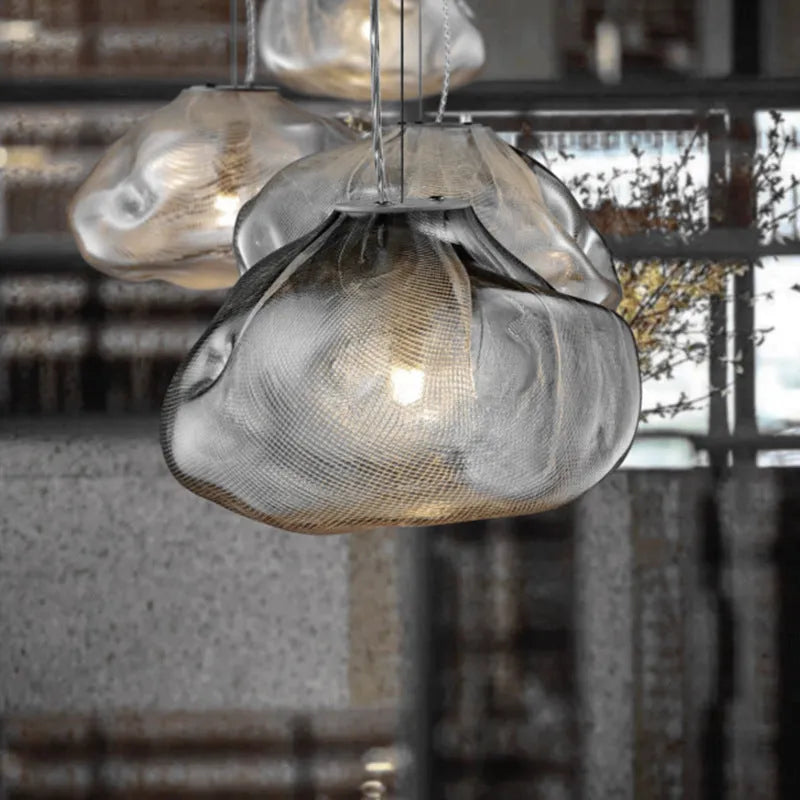 Modern fabric chandelier with glass shade shown in small and large sizes with clear, amber, and smoke grey light options.