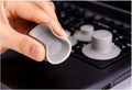 Four grey durable plastic laptop cooling pads shown in two different sizes on a table