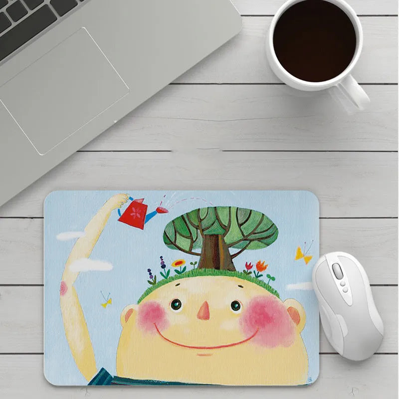 Custom cartoon thickening mouse pad on a desk, showing a colourful design with black stitched edge.