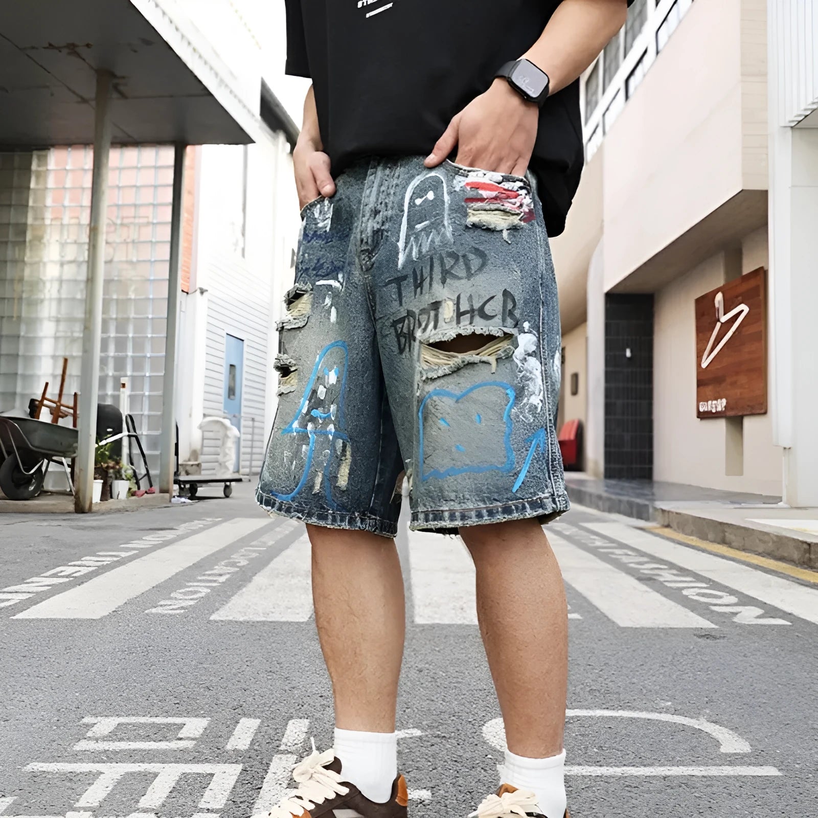 Blue ripped men's denim shorts with straight-leg cut and zipper fly closure
