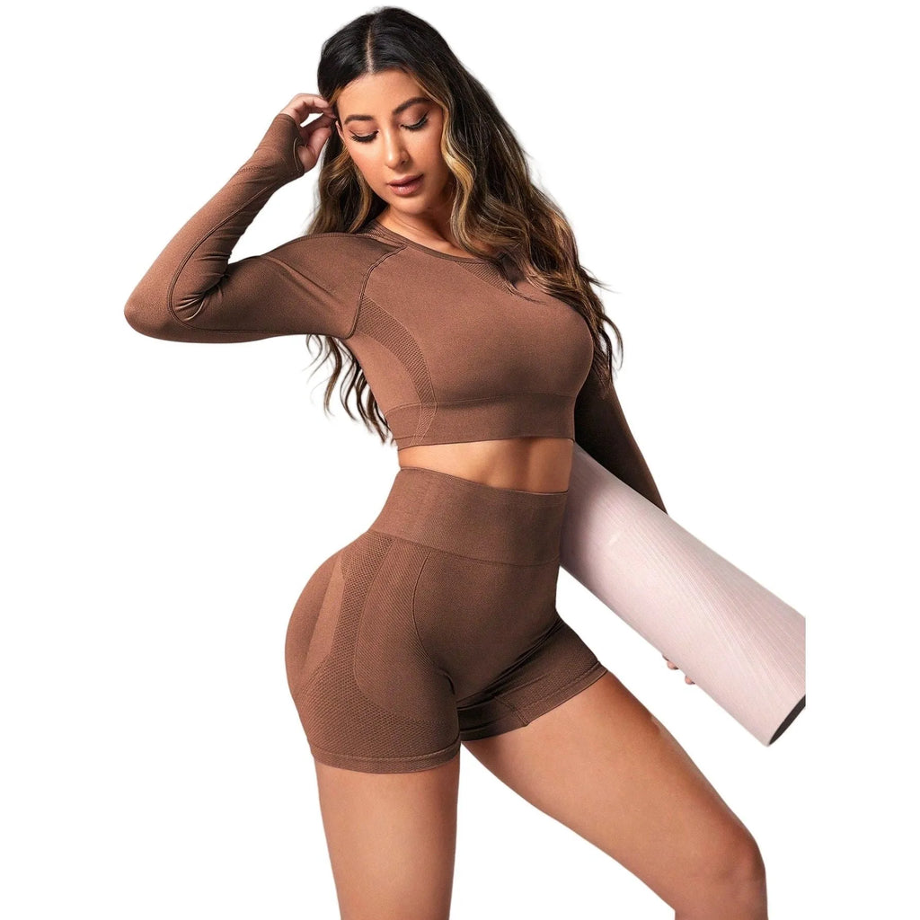 Women's high-waist yoga suit in black, featuring a long sleeve top and tight-fit trousers.