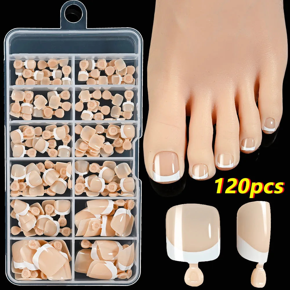 Box of 120 French white edge press-on toe nails in full square short shape showing multiple nude shades.