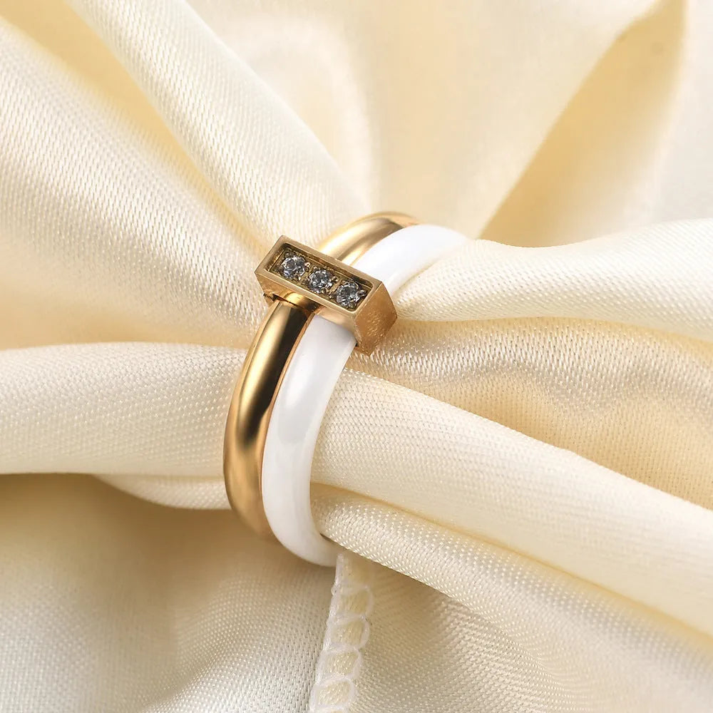 Ceramic women's ring with glossy stitching and zirconium accents in steel black or golden white, 6mm width
