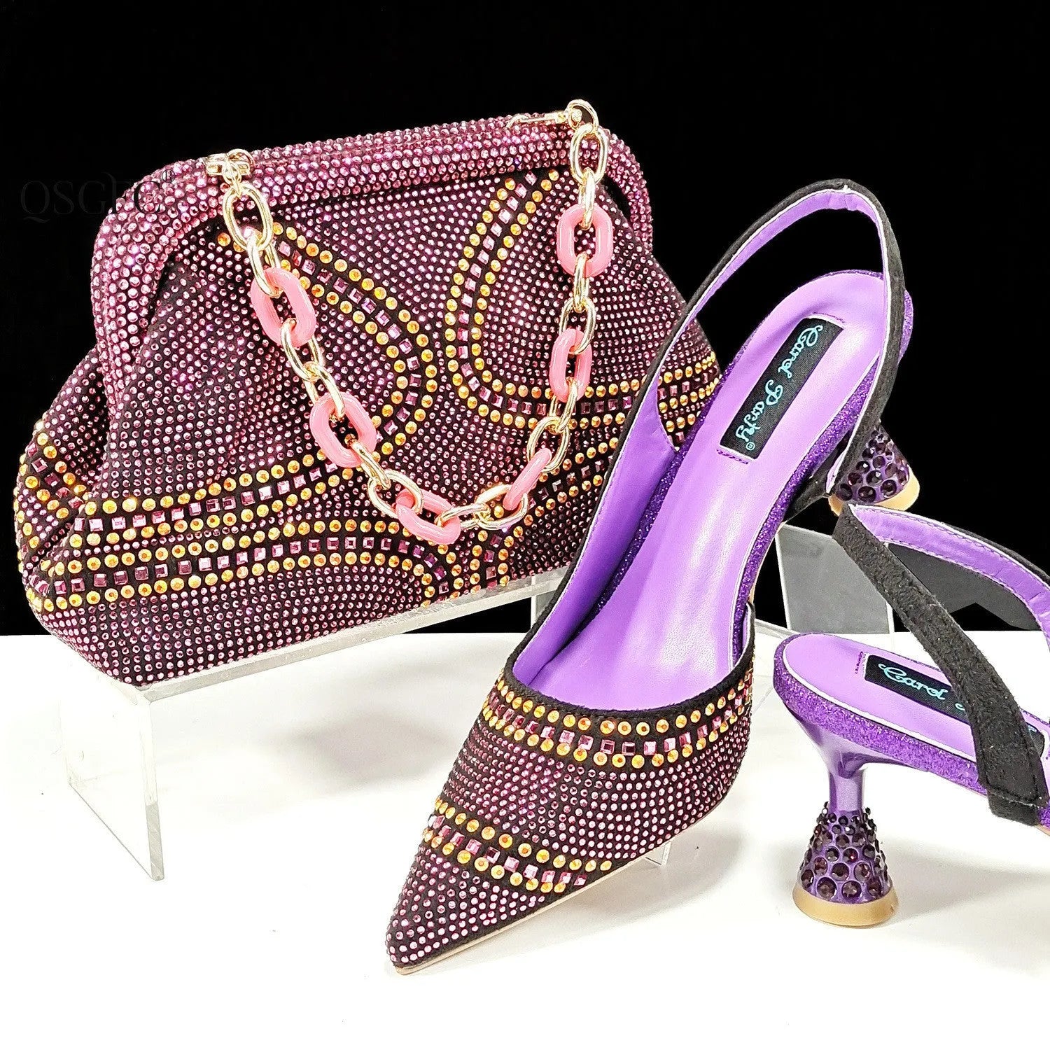 Women's pointed toe high heel shoes with decorative rhinestones and a matching small bag, shown in blue.